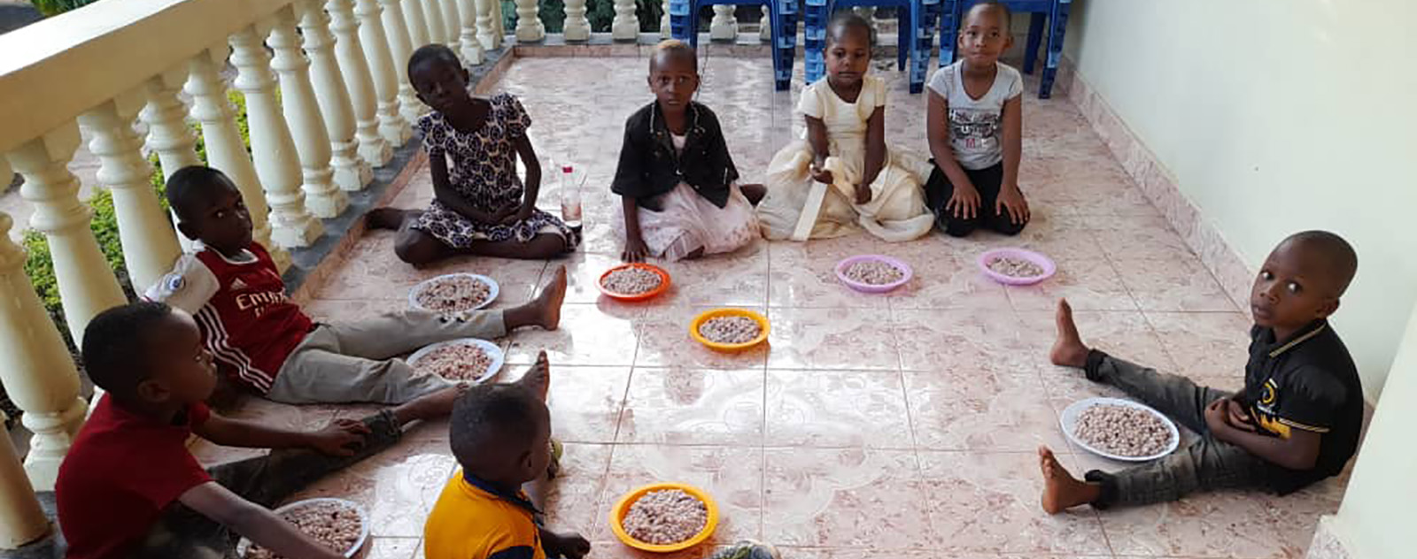 Group picture from Morogoro orphanage eating 1600 X 562